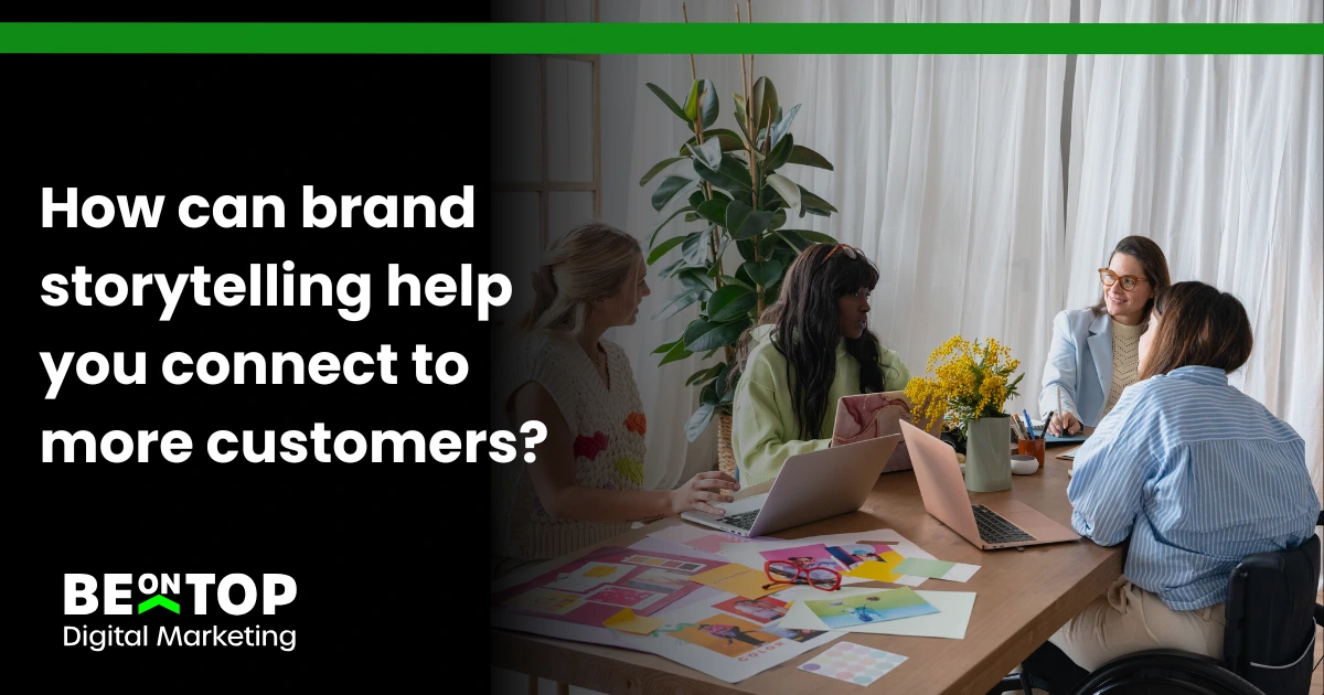 Creative team in discussion around laptops and mood boards at BeOnTop Digital Marketing agency.